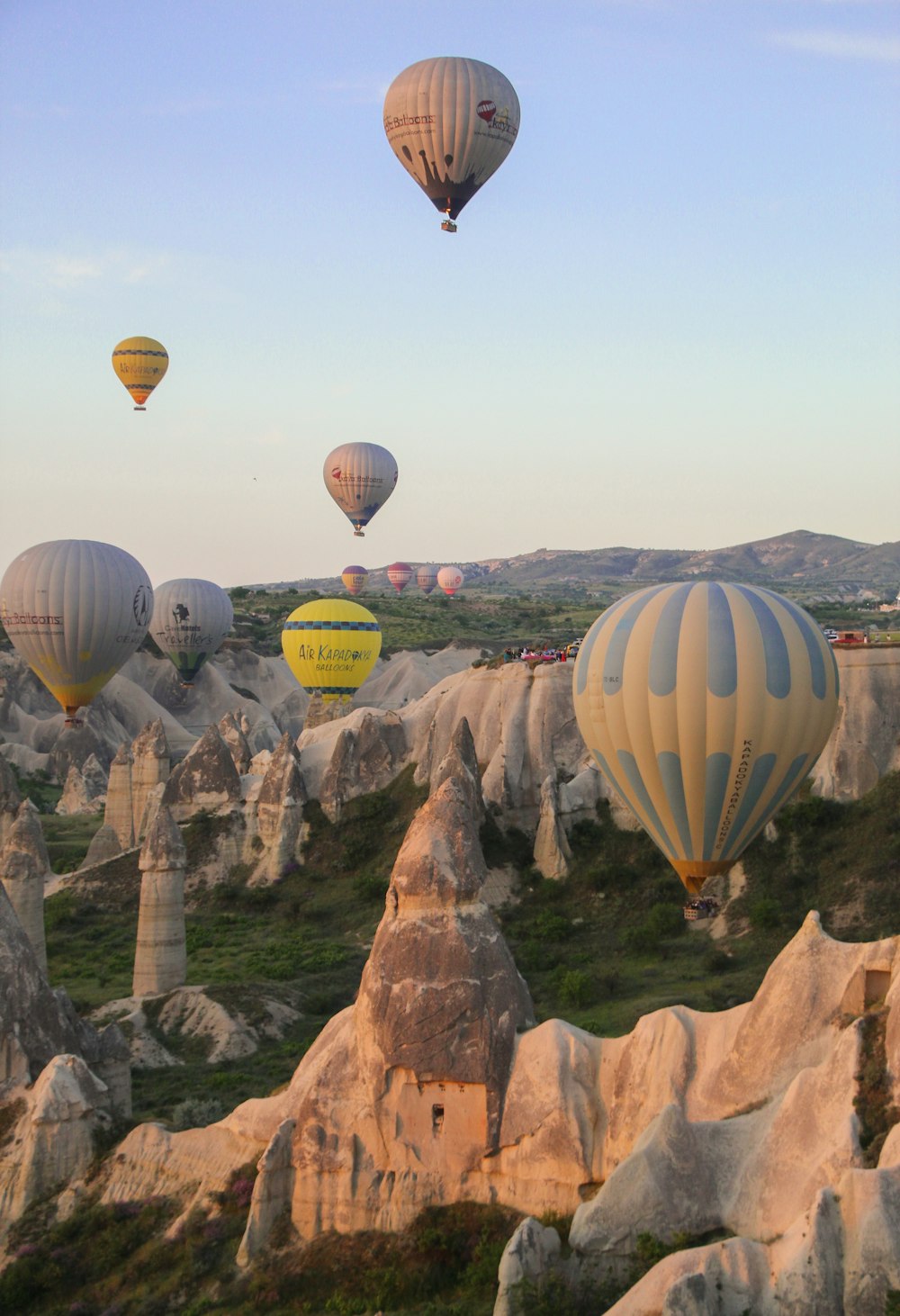 a group of hot air balloons flying in the sky