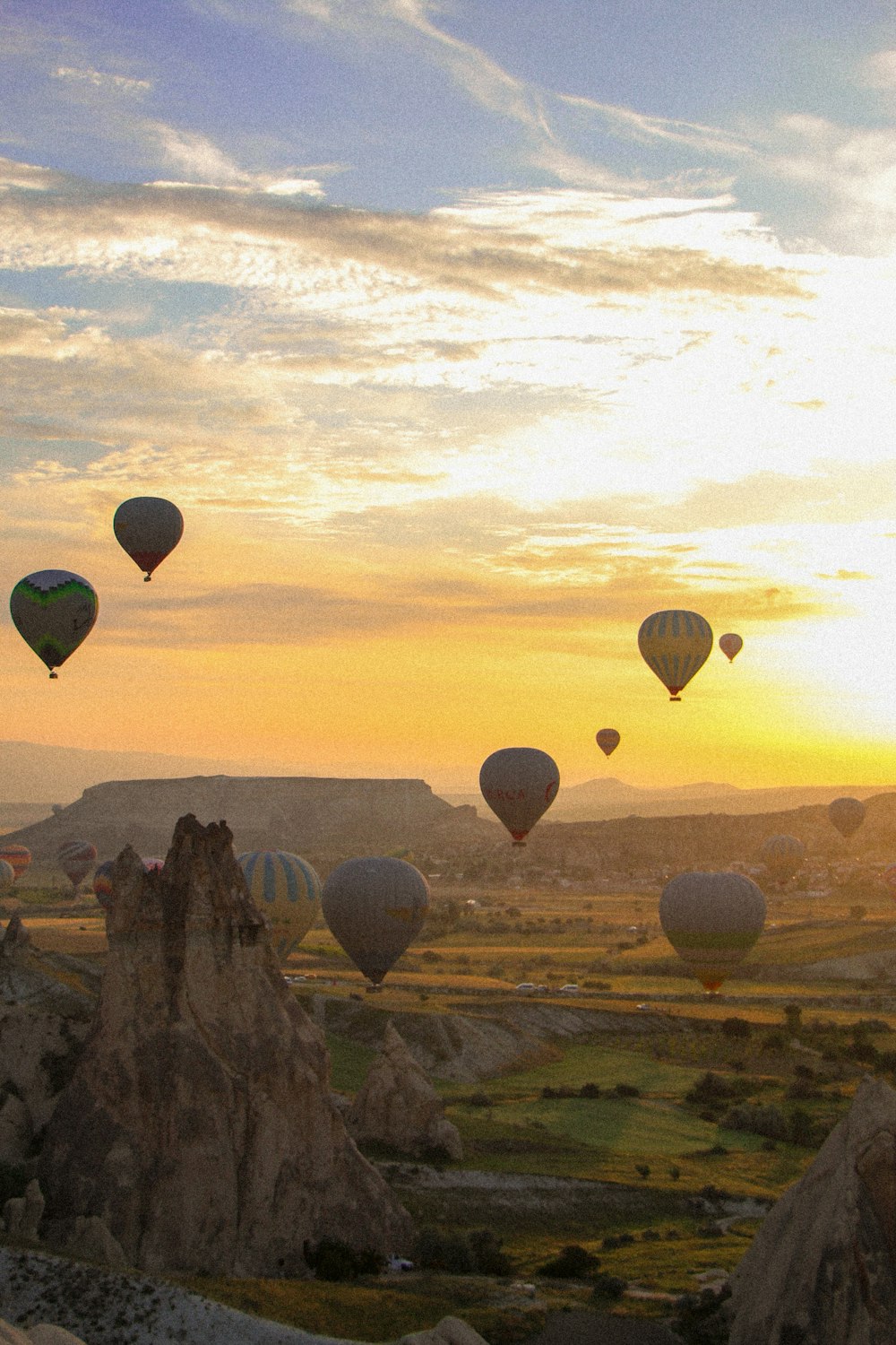 a group of hot air balloons flying in the sky