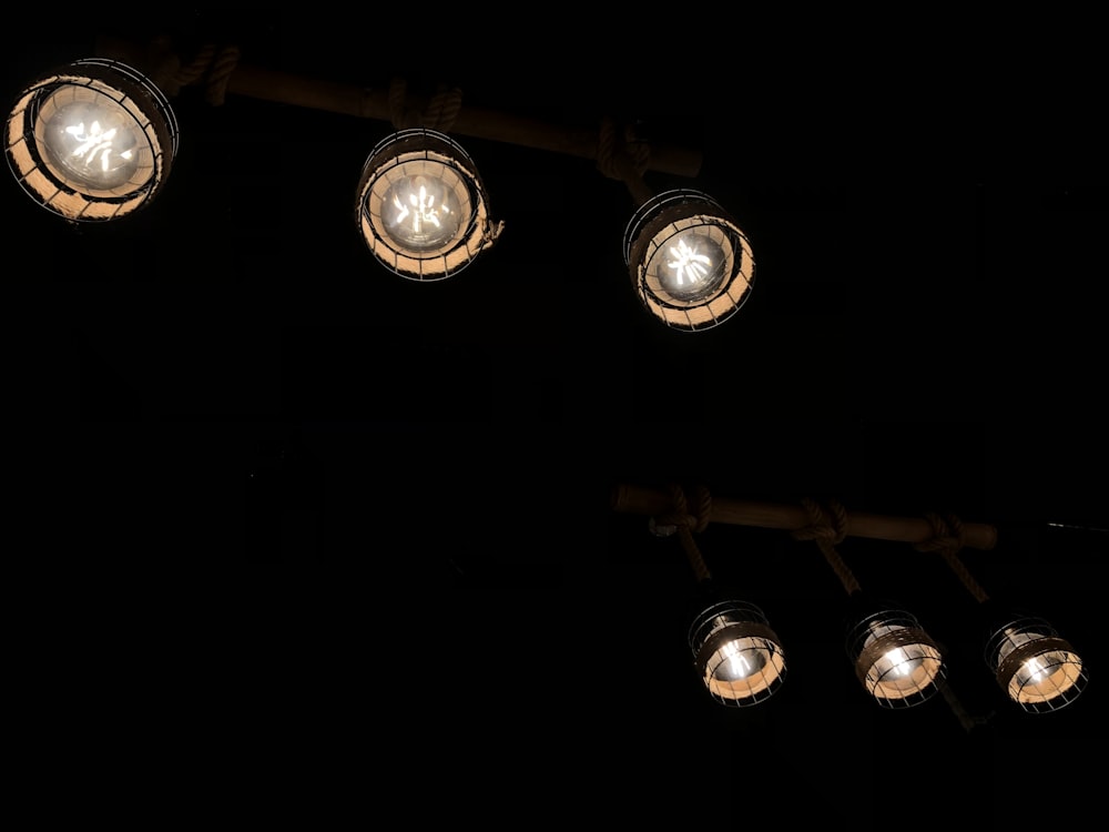 a group of lights that are on a pole