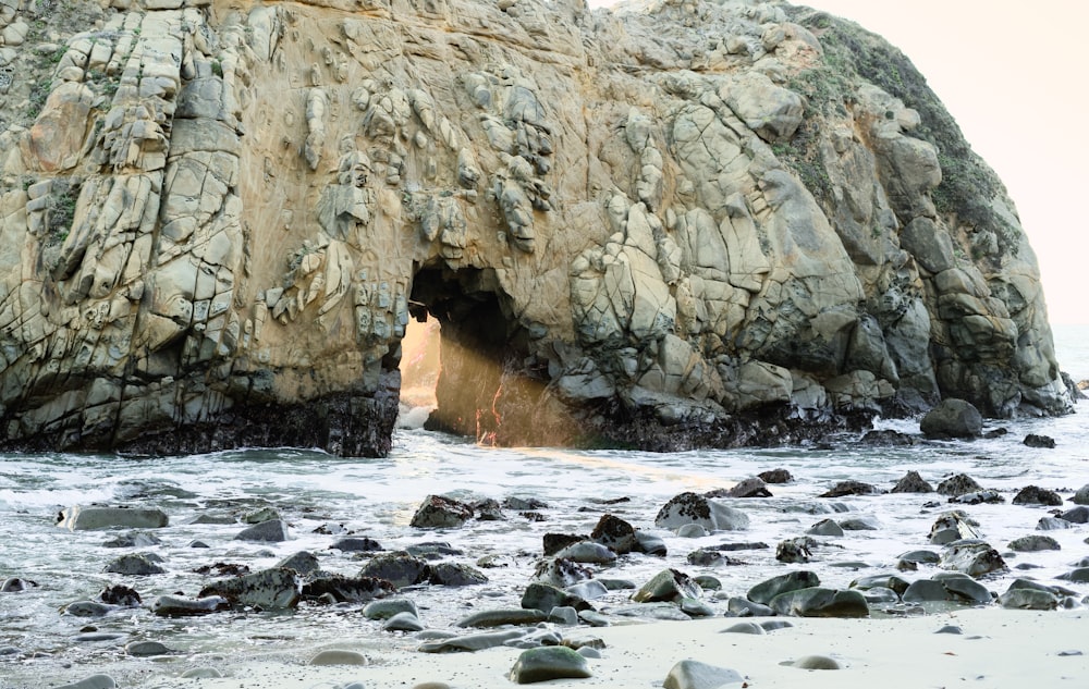 a rock formation with a cave in the middle of it