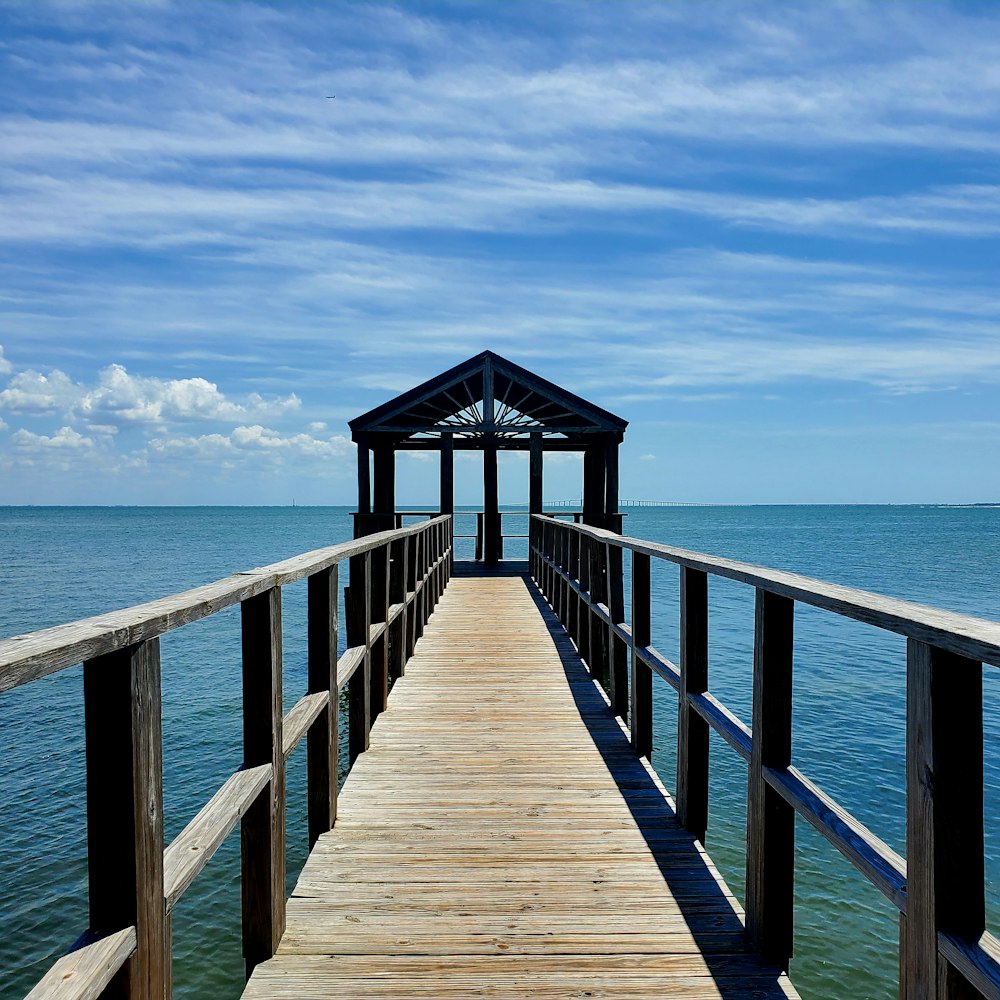 a wooden pier extending out into the ocean