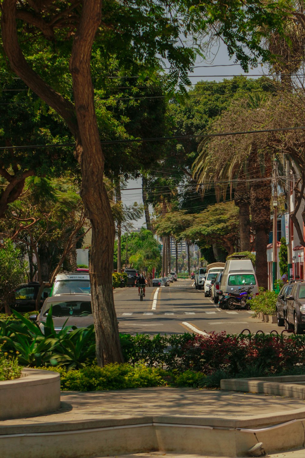 a street with cars parked on the side of it