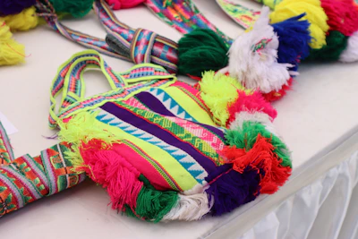 Close-up of colorful recycled plastic bags woven into a sturdy fabric.