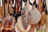 a person holding a bunch of seashells in their hand