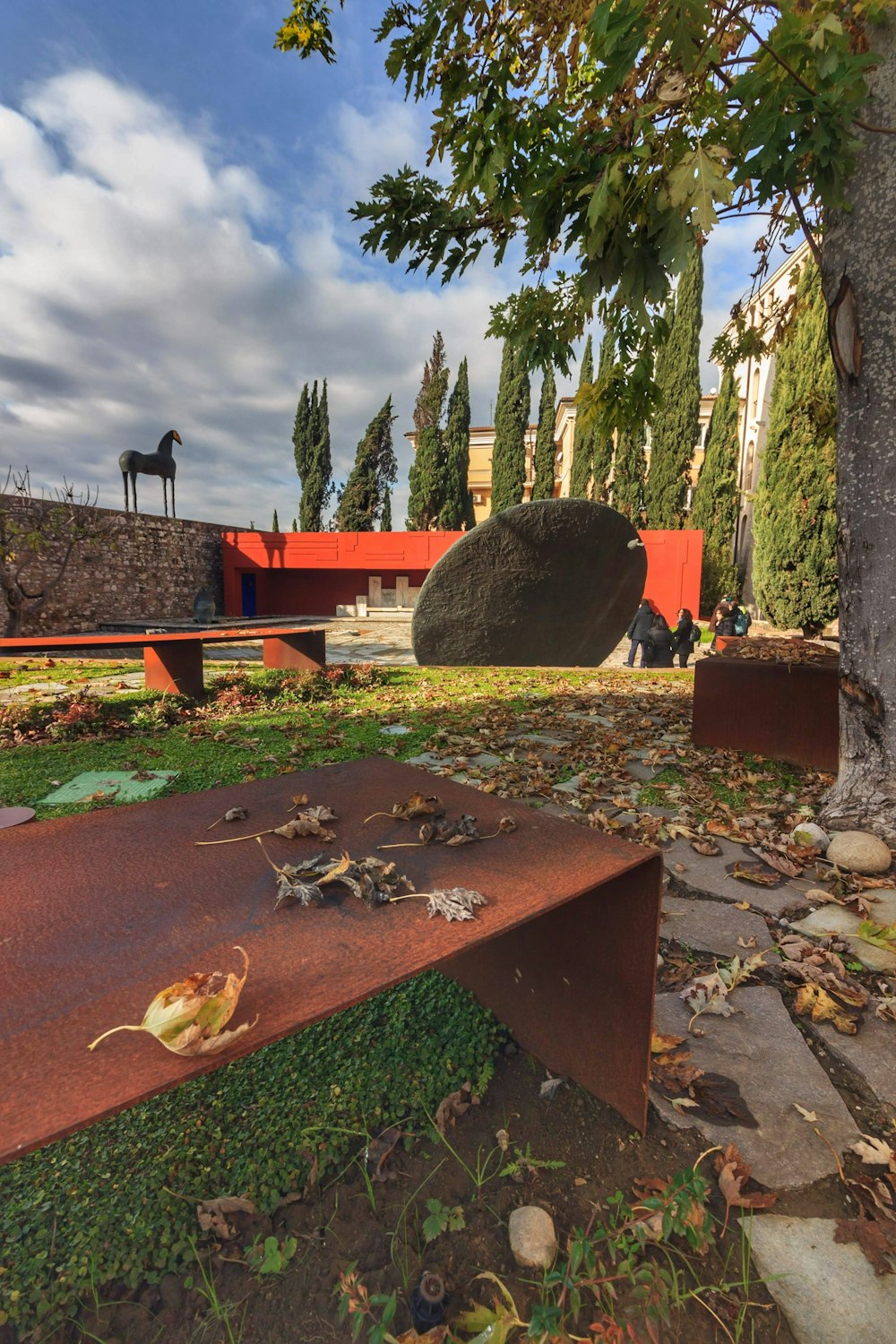 a bench sitting in the middle of a park