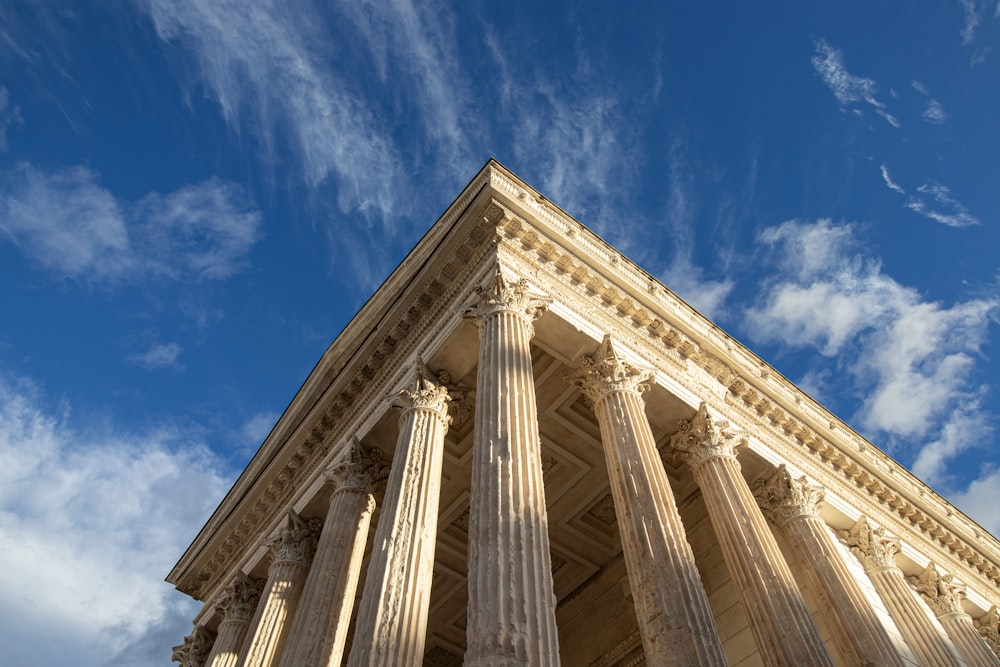 a very tall building with some columns on top of it