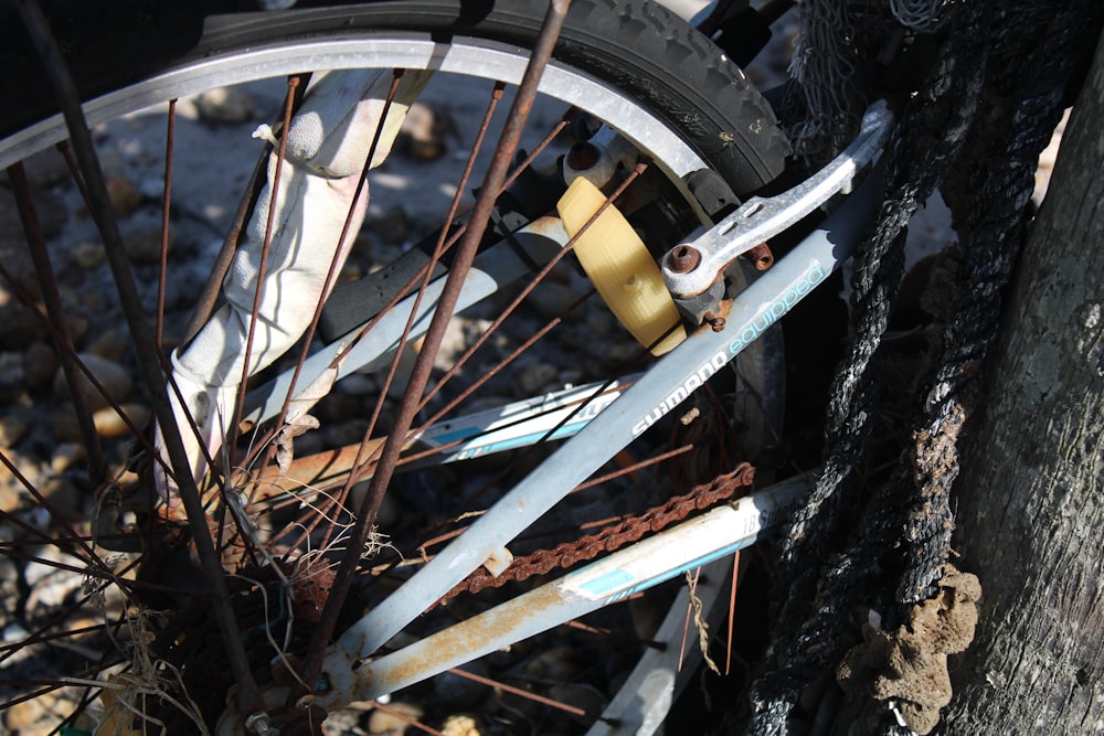 a broken bicycle wheel sitting on the ground