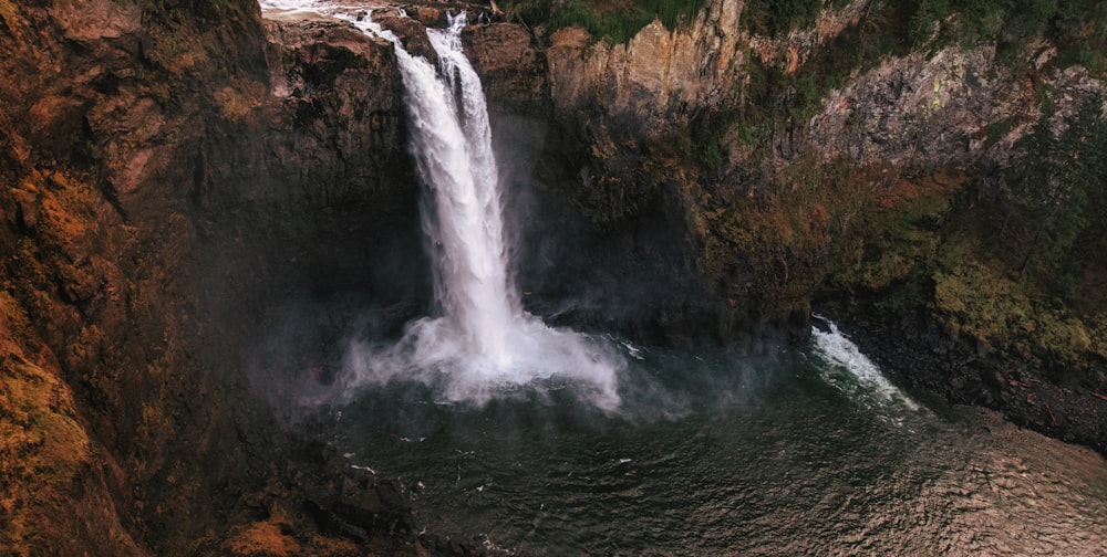 a large waterfall with water coming out of it