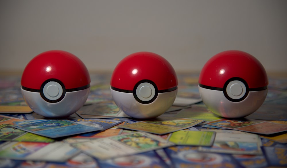 three pokemon balls sitting on top of a table