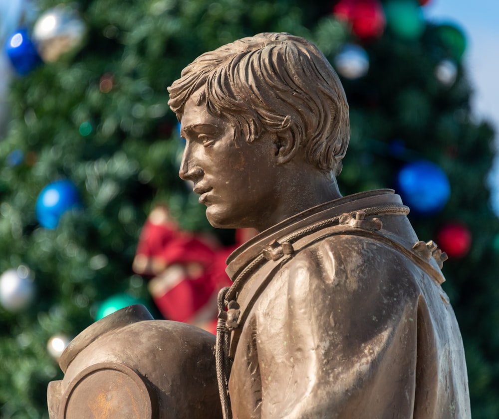 a statue of a boy holding a fire hydrant