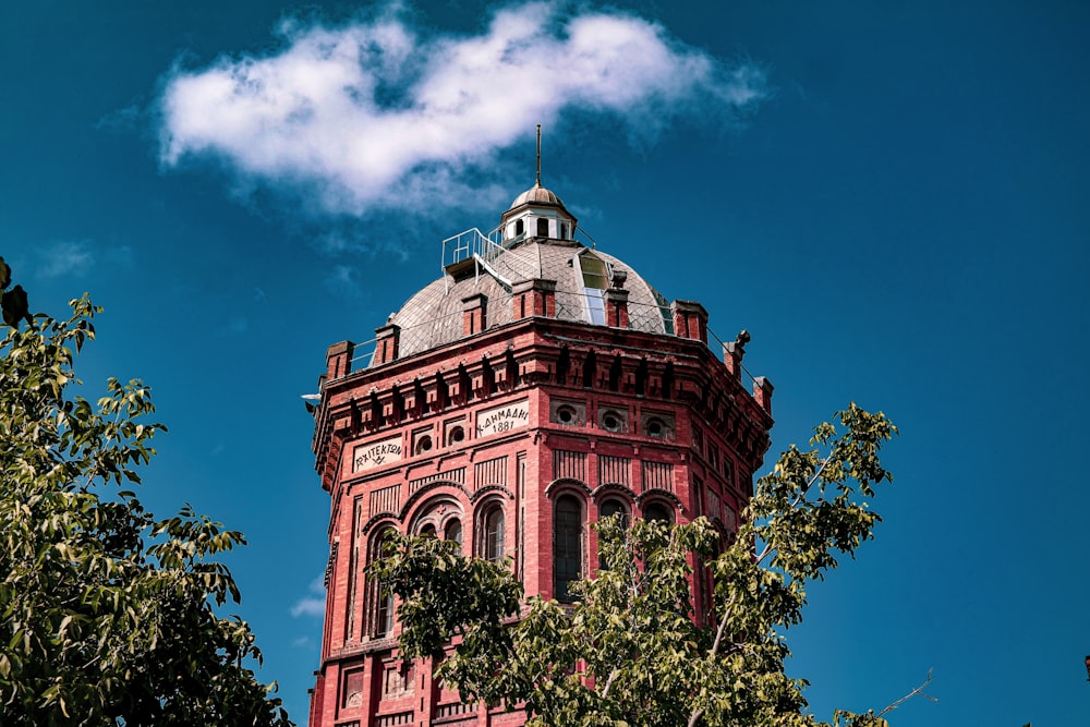 a tall tower with a clock on the top of it