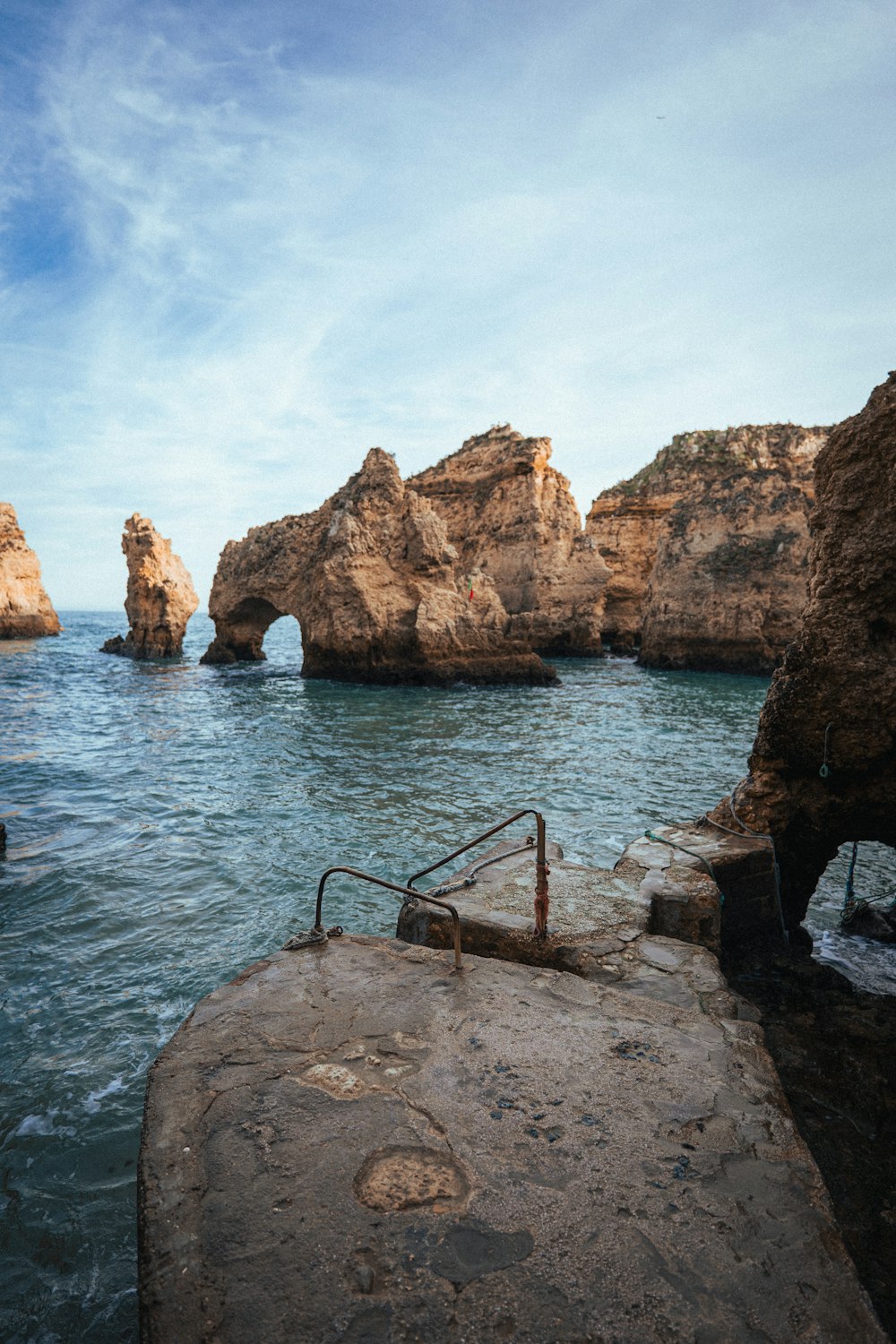 a rock outcropping in the middle of a body of water