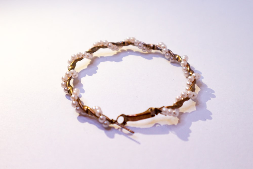 a close up of a bracelet on a table