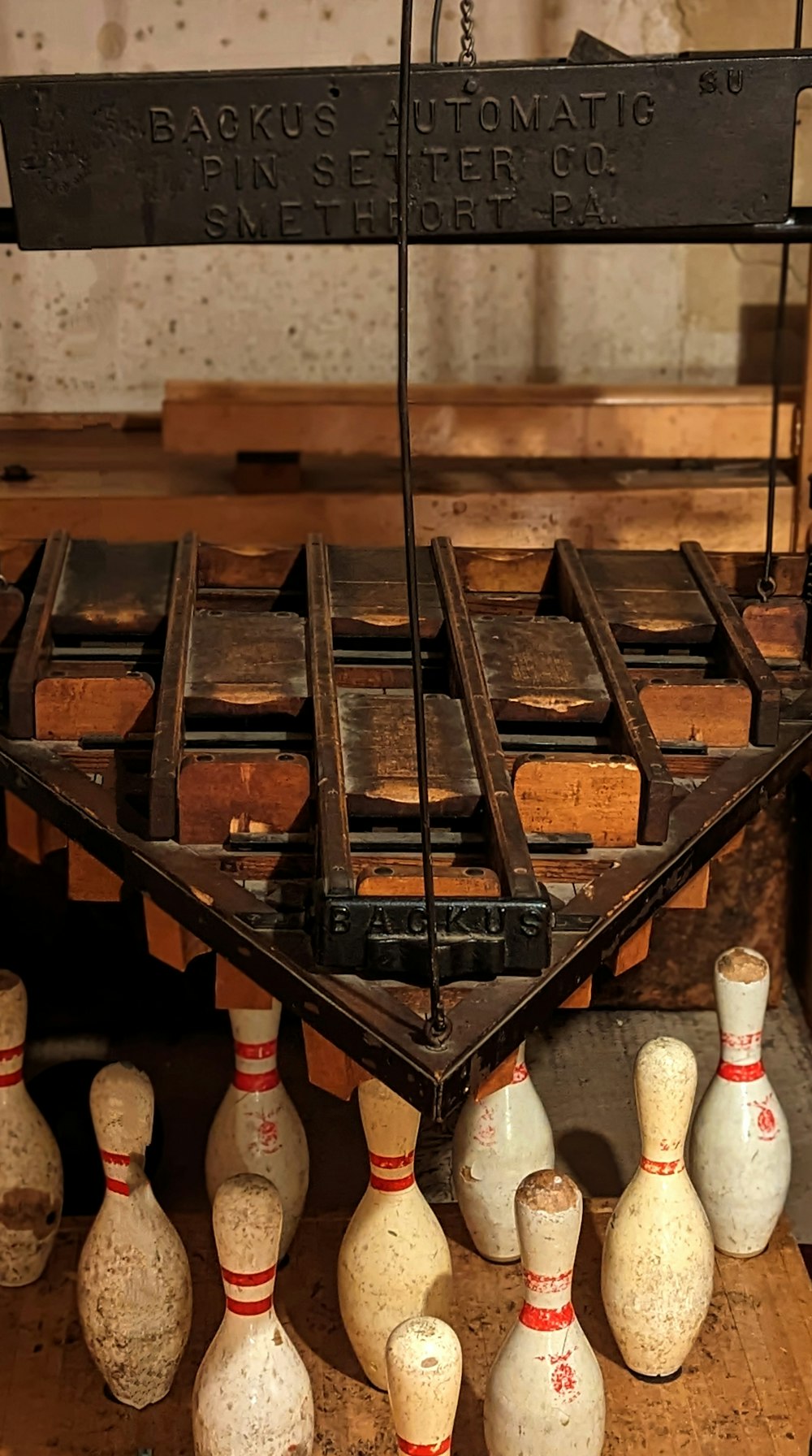 a bunch of bowling pins sitting on top of a wooden table