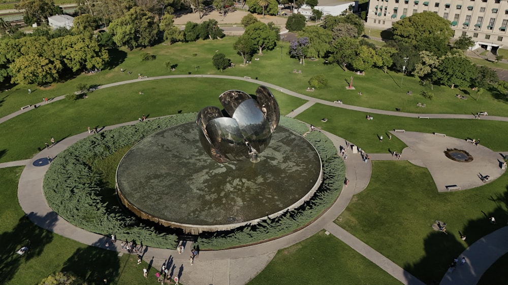 a bird's eye view of a park with a fountain