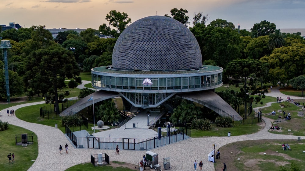 an aerial view of a circular building in a park