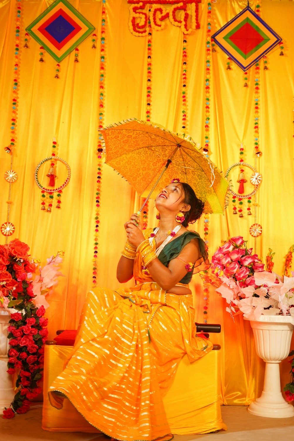 a woman in a yellow dress holding an umbrella