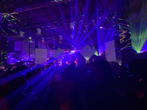 Colorful moving head lights casting dynamic patterns in a dark room.