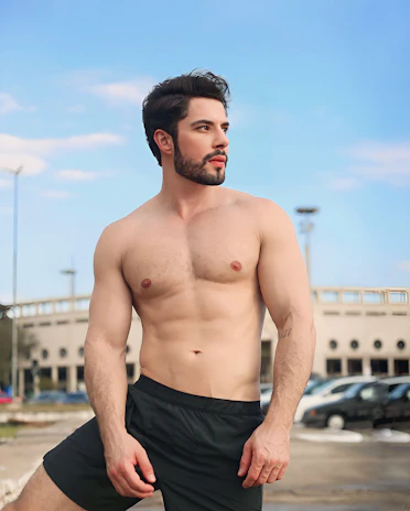 Post-cut photo shoot capturing a confident man with a trendy urban hairstyle and beard