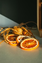 Elegant dried orange slices stacked neatly with soft lighting highlighting their texture.