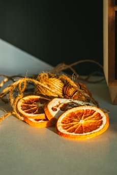 Elegant dried orange slices stacked neatly with soft lighting highlighting their texture.