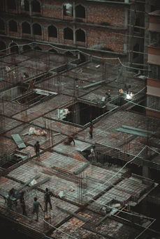 Modern construction site with workers collaborating on a building framework.