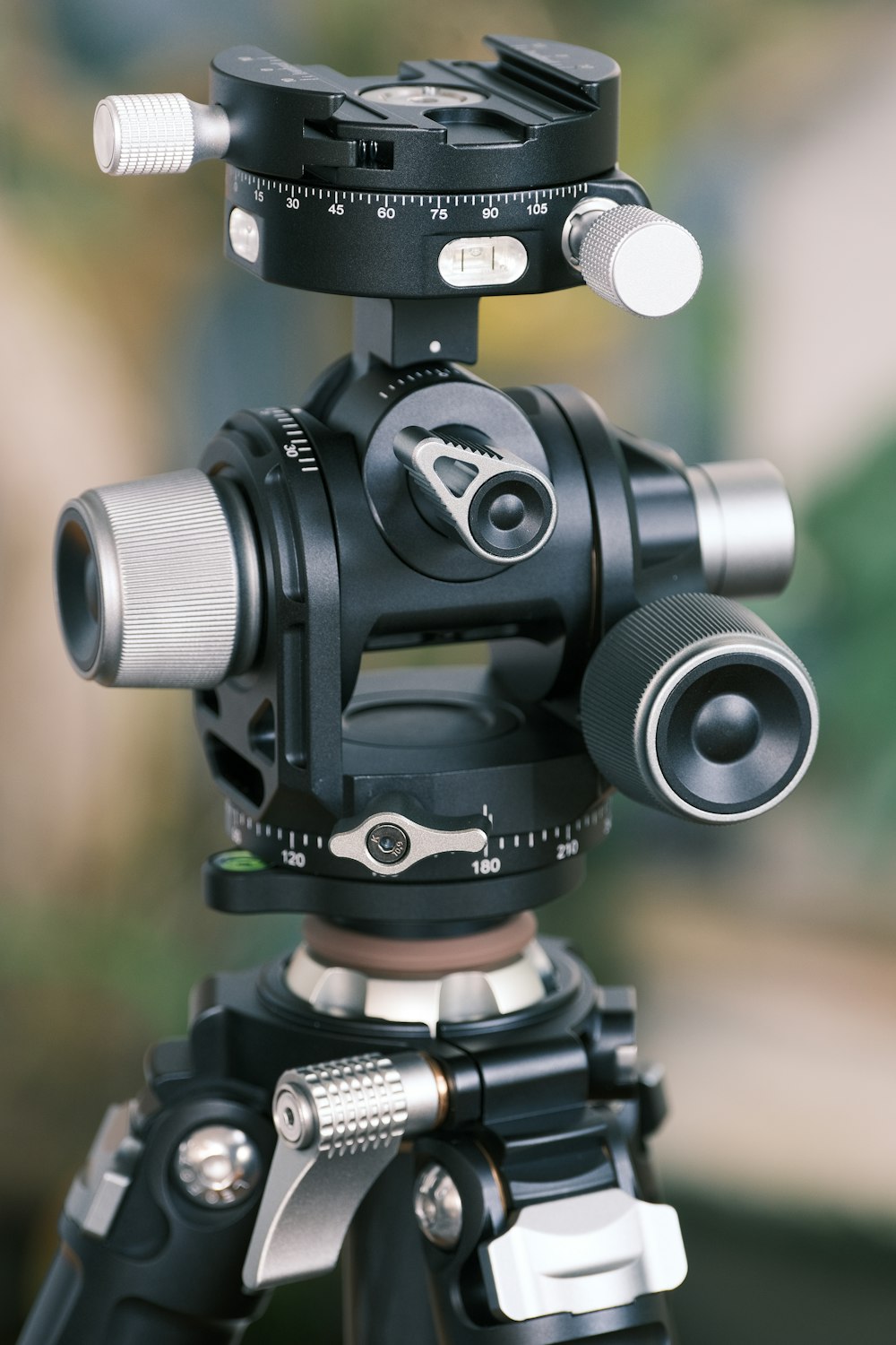 a tripod with a camera attached to it