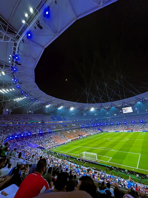 Wide view of Emilio Roto Stadium filled with cheering fans under bright lights