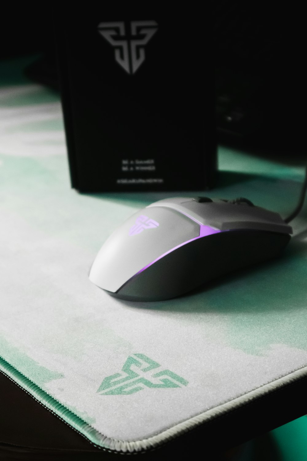 a computer mouse sitting on top of a mouse pad