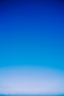 A serene blue header image with gentle pastel gradients evoking calm and peace.