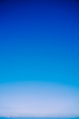 A serene blue header image with gentle pastel gradients evoking calm and peace.