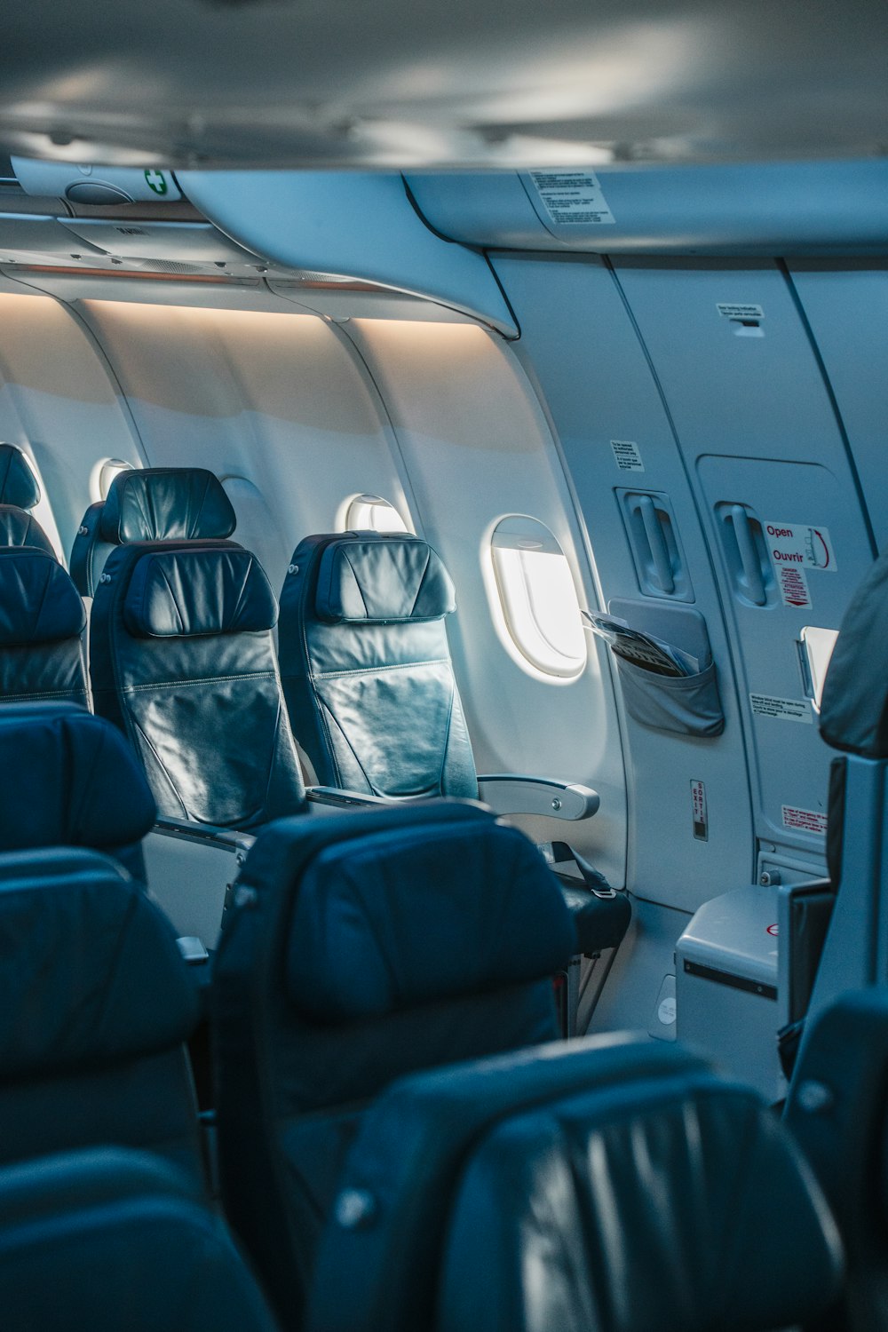 the inside of an airplane with leather seats