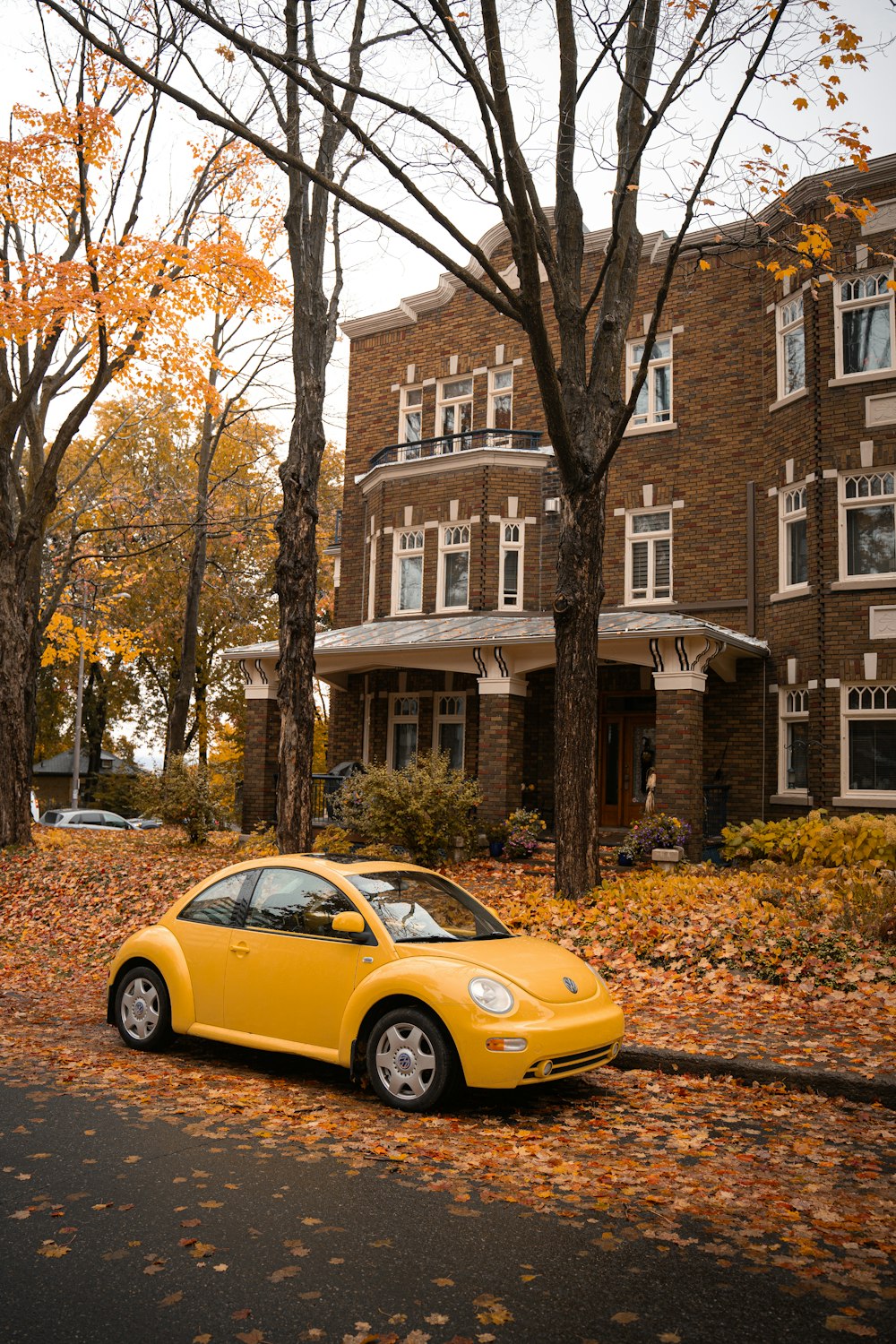 a yellow car parked on the side of the road