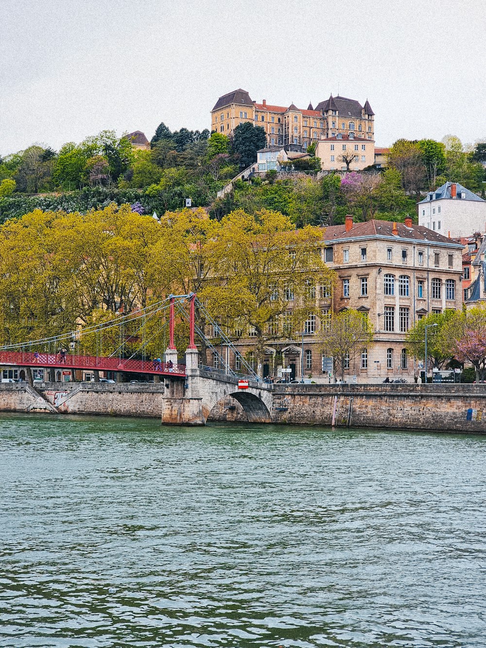 a boat is on the water near a city