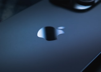 Close-up of an Apple product with a warranty seal badge.