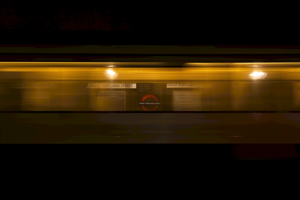 a blurry photo of a train at night
