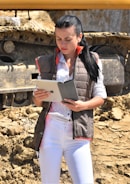 Project manager monitoring construction progress on a tablet.