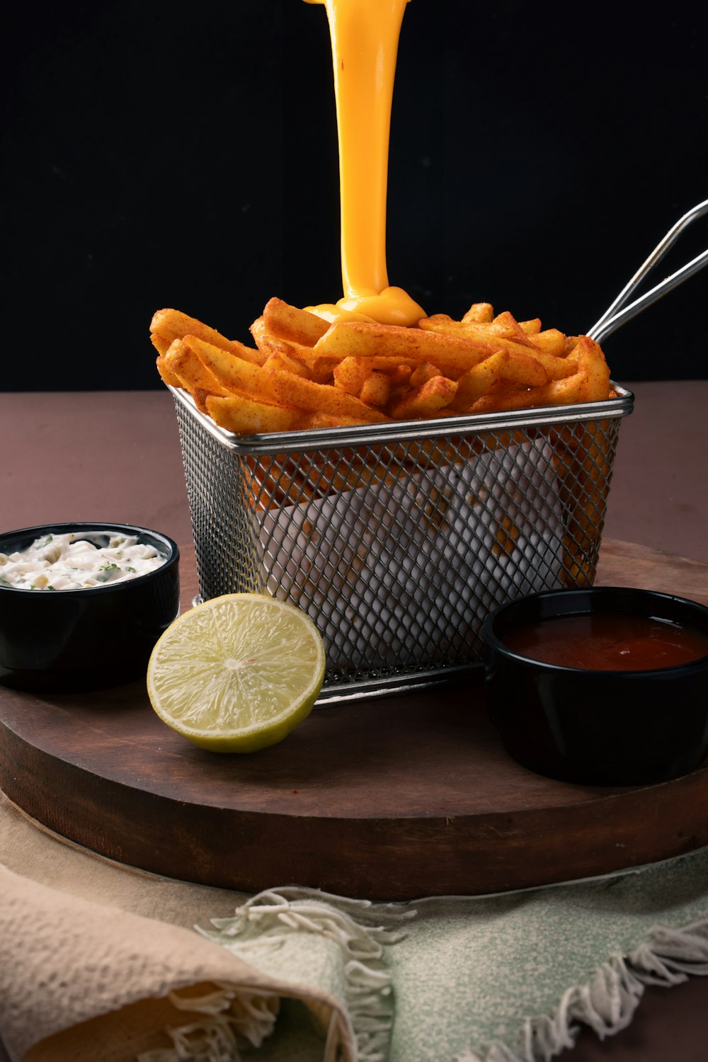 a basket filled with fries and dipping sauce