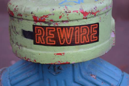 a close up of a fire hydrant with a sign on it