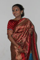 Close-up of a Bollywood celebrity smiling on the red carpet.