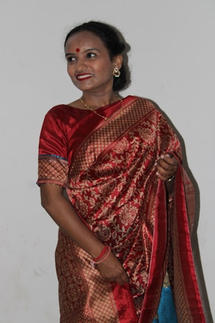 Photo of a Bollywood actor smiling on a red carpet event.