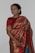 A happy customer wearing a beautiful saree from Jolly's Creation.