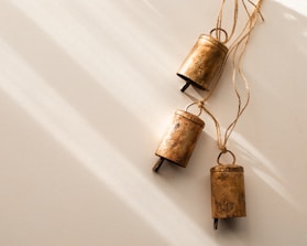 a couple of bells hanging from a string