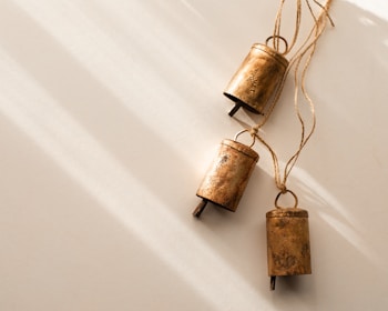 a couple of bells hanging from a string