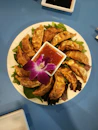 a plate of food with a flower on it