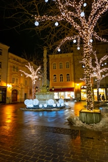 Villalba's main plaza illuminated with festive lights and holiday decorations at night.