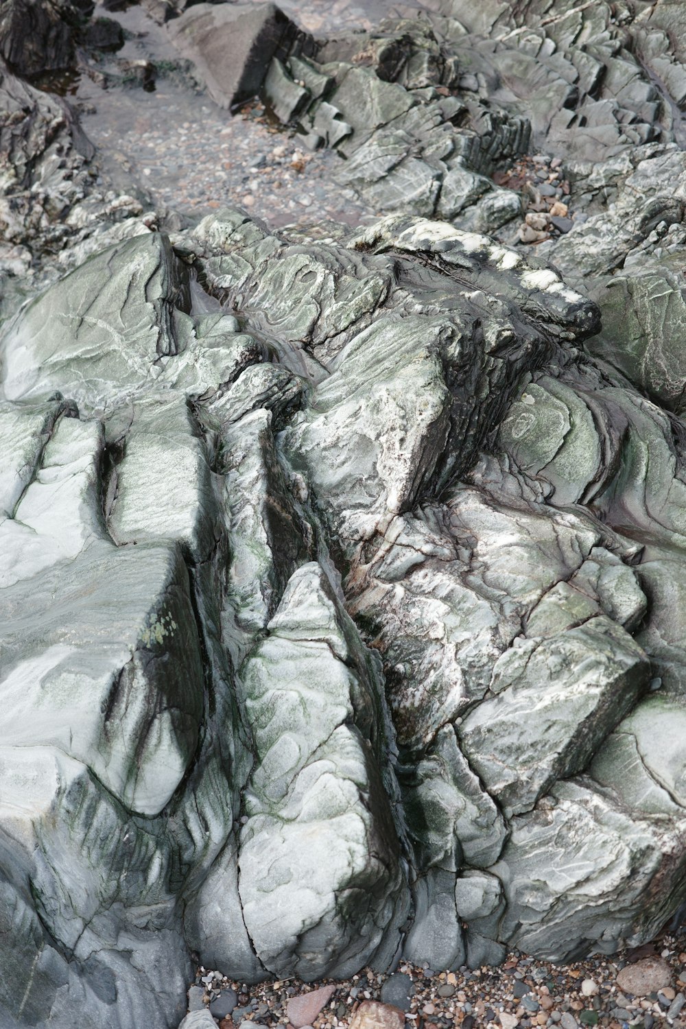 a close up of a rock formation with a bear in the middle of it