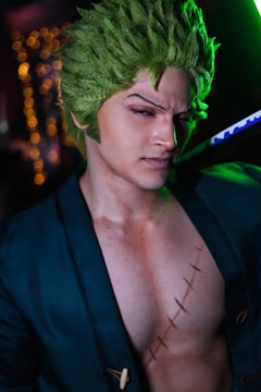 Close-up of a demon slayer wielding an occult-infused blade, green digital runes flickering across their armor in a dimly lit command center.