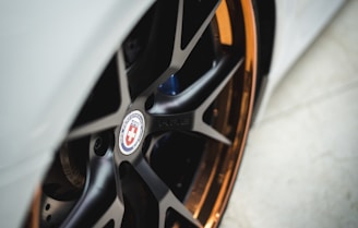 Close-up of colorful centre caps installed on a sleek VW wheel.