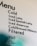 A partial view of a cafe menu displaying various cold and filtered beverage options, including types of lattes, cold brews, and filtering methods.